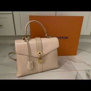 Louis Vuitton Cross body. Unique and very few made. Gently used.